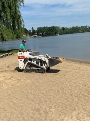 Parks Staff dumping beach sand